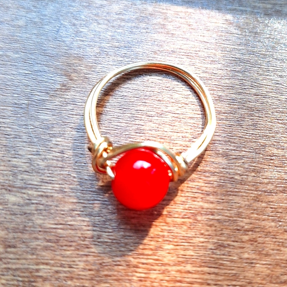 Elegant Gold Tone Ring with Red Center